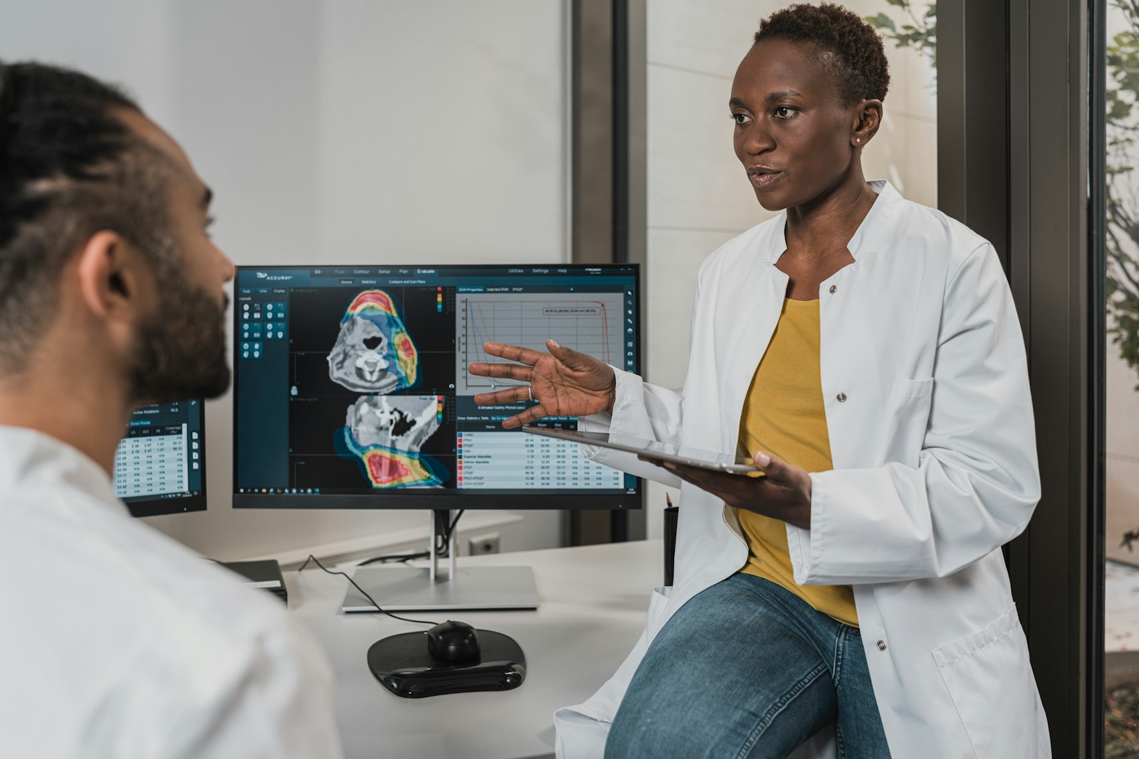Healthcare clinicians reviewing diagnostic imaging
